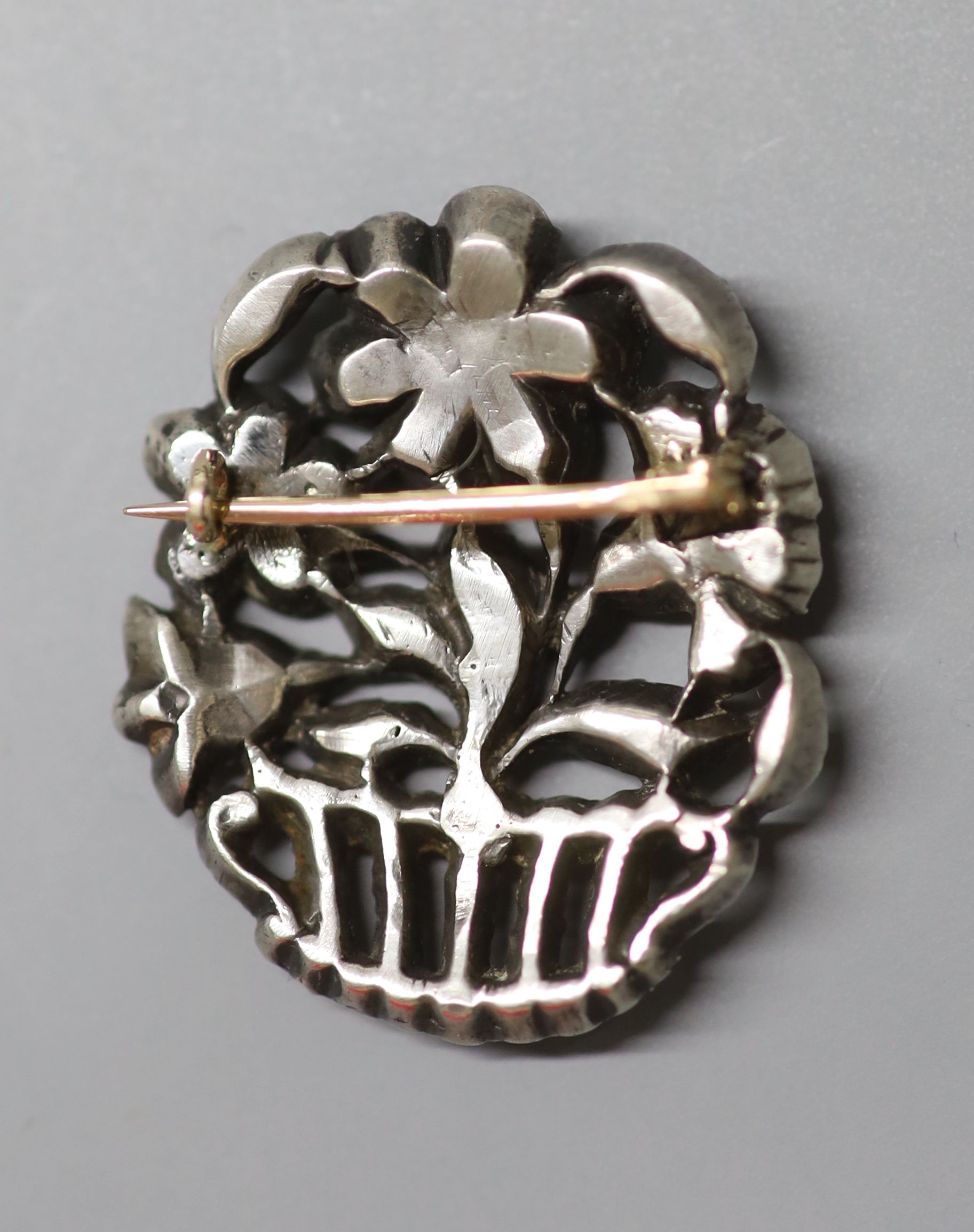 A white metal and paste set giardinetto brooch, 33mm.